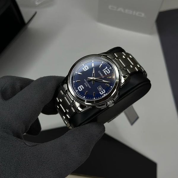 Чоловічий годинник CASIO MTP-1314D-2AVDF сріблястий масивний з арабськими цифрами синій циферболат 1045190704554 фото