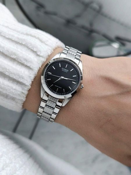 Женские часы CASIO LTP-1274D-1A серебристые с черным циферблатом 113882873 фото
